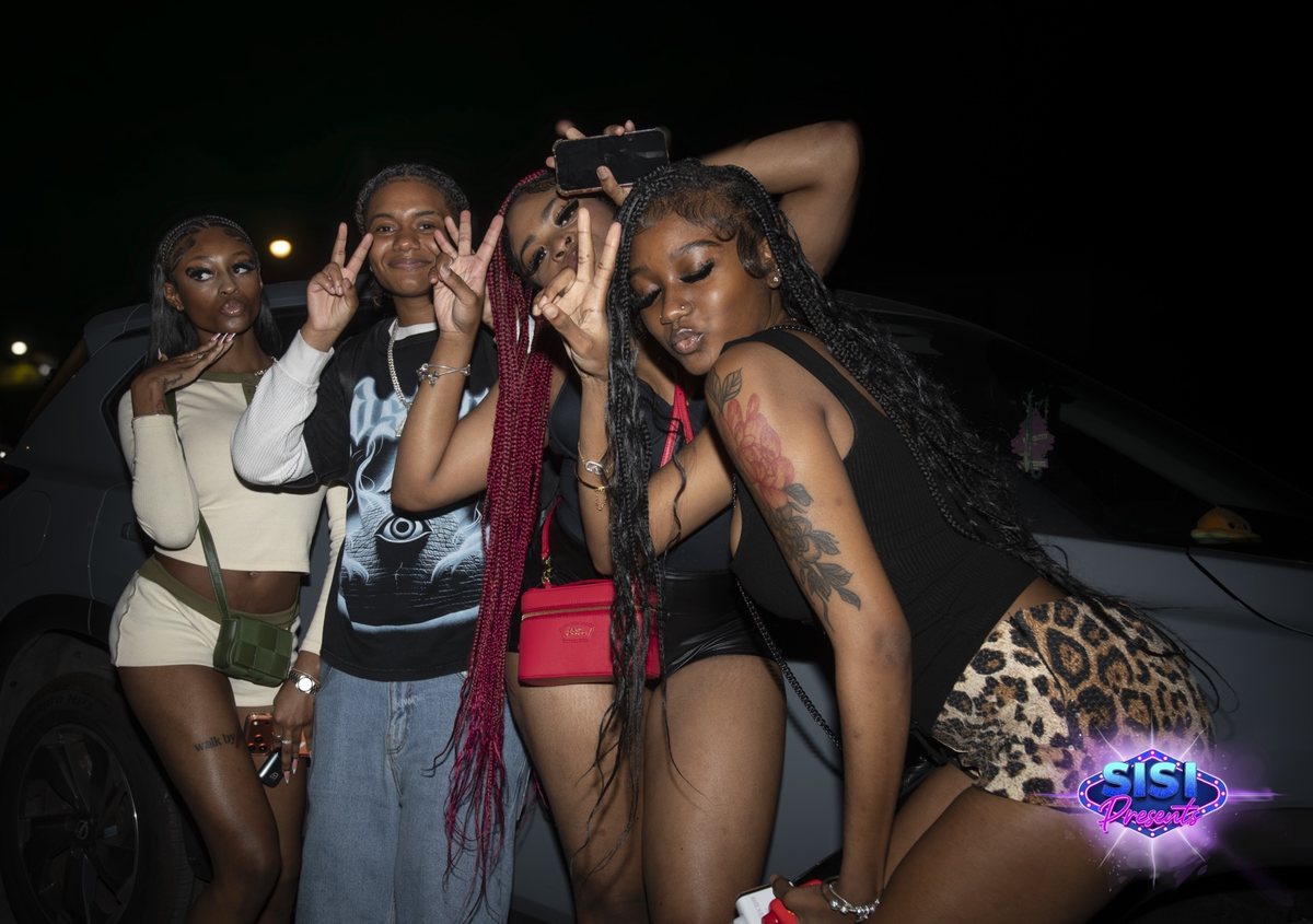 Friends posing at a SiSi Presents event