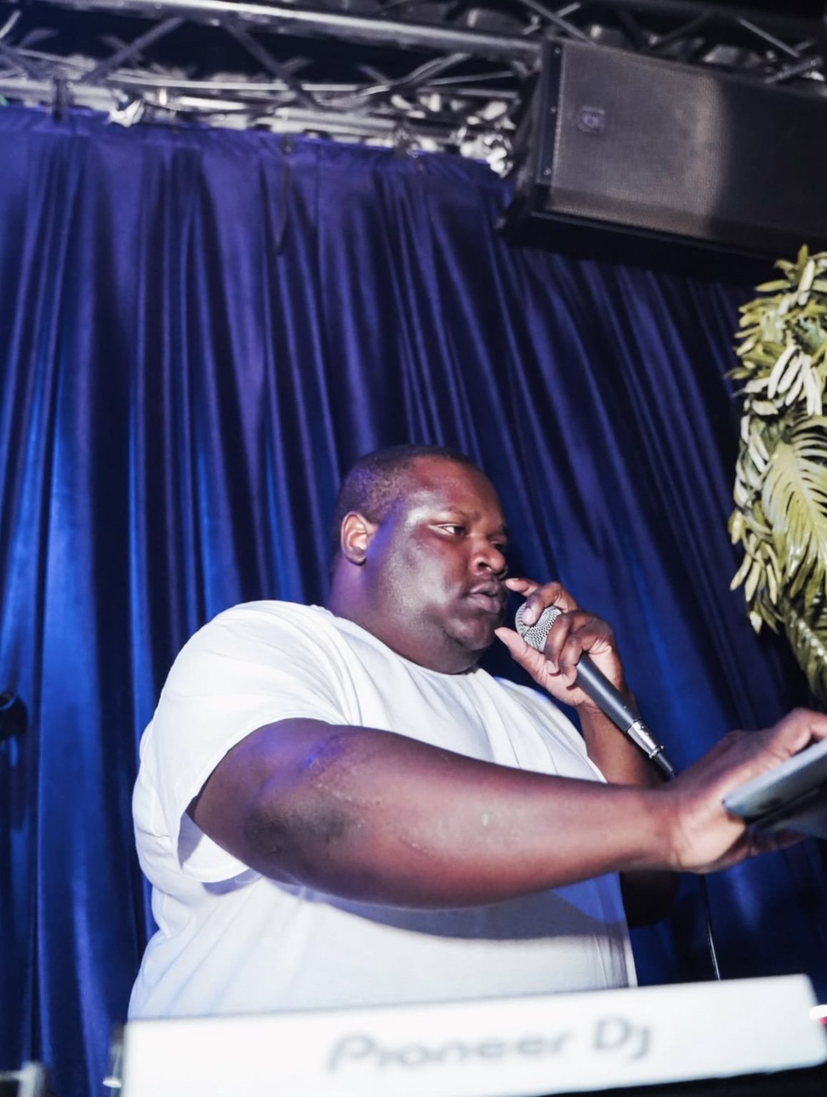 DJ on the microphone at SiSi Presents