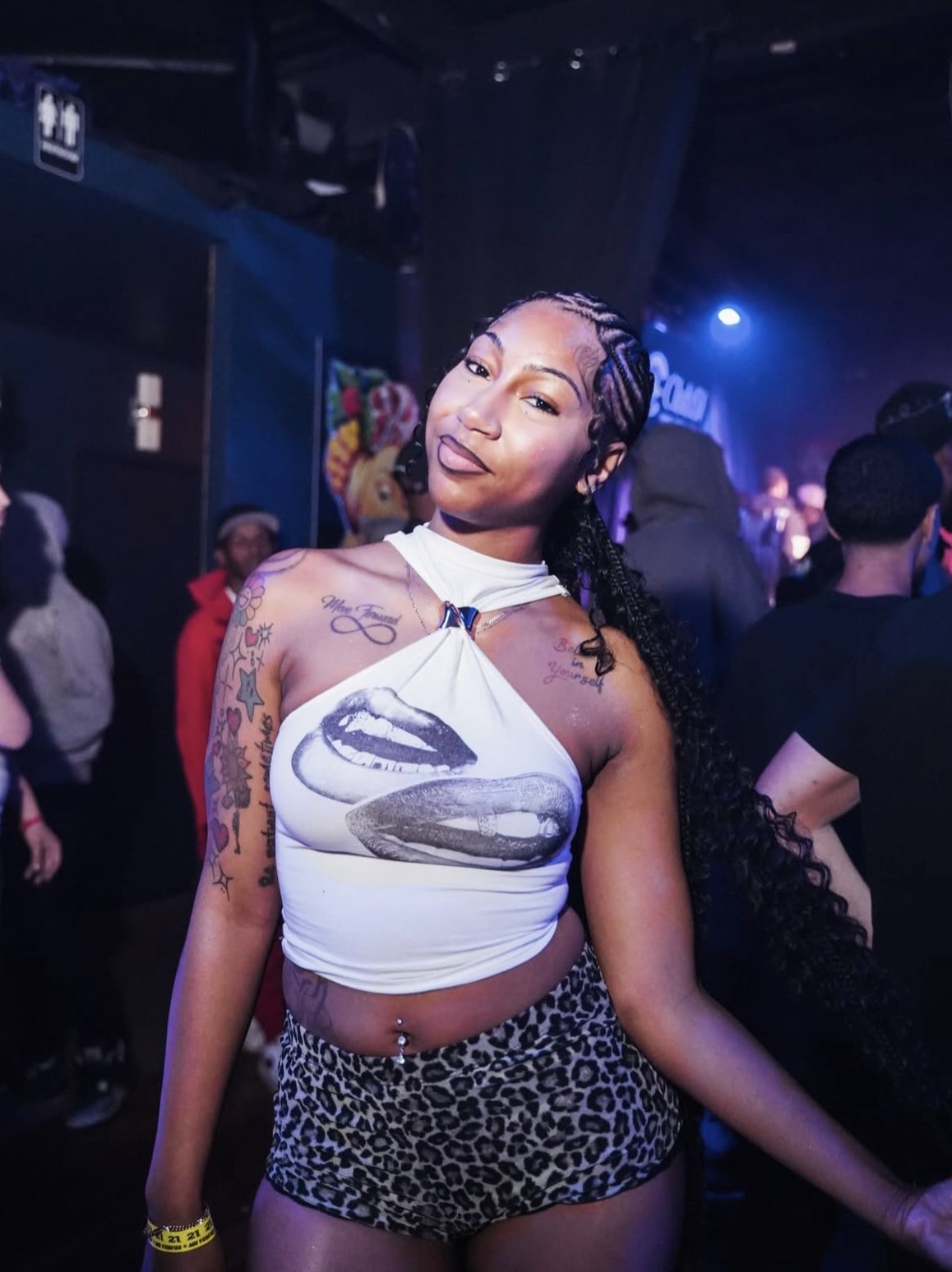 Guest posing inside a SiSi Presents event